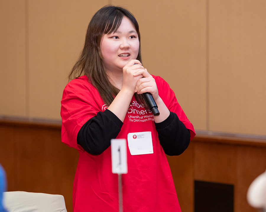 A student talks into a microphone