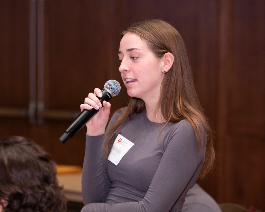 A student talks into a microphone